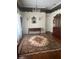 Elegant living room featuring a chandelier, dark wood furniture, and an ornate area rug on hardwood floors at 3210 W North B St, Tampa, FL 33609