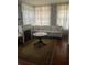 Living room with floral wallpaper, fireplace, decorative curtains, and a floral pattern sofa at 3210 W North B St, Tampa, FL 33609