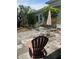 Outdoor patio with furniture and light-colored chairs perfect for entertaining or relaxing in an intimate backyard setting at 3210 W North B St, Tampa, FL 33609