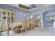 Elegant dining room with an ornate hutch and table set, perfect for entertaining guests at 3603 Arbor Chase Dr, Palm Harbor, FL 34683
