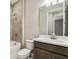 Modern bathroom featuring a bathtub and a dark cabinet with white countertops at 3737 Nandina Cir, Sun City Center, FL 33573