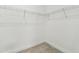 Empty walk-in closet with wire shelving and tile flooring at 3737 Nandina Cir, Sun City Center, FL 33573