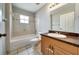 Bathroom with a tub, shower, and a vanity with a sink at 37437 Laurel Hammock Dr, Zephyrhills, FL 33541