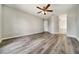 Spacious bedroom with hardwood flooring and a ceiling fan at 37437 Laurel Hammock Dr, Zephyrhills, FL 33541