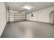 Spacious two-car garage with fresh paint and ample storage space at 37437 Laurel Hammock Dr, Zephyrhills, FL 33541