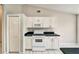 Close up of a kitchen featuring white oven and white cabinets at 37437 Laurel Hammock Dr, Zephyrhills, FL 33541