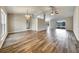 Open-concept living room with hardwood floors and an abundance of natural light at 37437 Laurel Hammock Dr, Zephyrhills, FL 33541