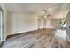 Well-lit living room boasting hardwood floors, ceiling fan, and access to the backyard at 37437 Laurel Hammock Dr, Zephyrhills, FL 33541