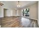Inviting living room featuring hardwood floors, recessed lighting, and plenty of natural light at 37437 Laurel Hammock Dr, Zephyrhills, FL 33541