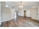 Spacious living room featuring high ceilings, hardwood floors, and neutral paint at 37437 Laurel Hammock Dr, Zephyrhills, FL 33541