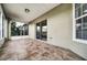 Enclosed patio with tile flooring, ceiling fan, and plenty of natural light at 37437 Laurel Hammock Dr, Zephyrhills, FL 33541