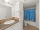 Functional bathroom with a single sink vanity, ample storage, and a shower/tub combination, designed for everyday use at 37639 Newport Dr, Zephyrhills, FL 33542