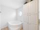 Bright bathroom featuring a soaking tub and a window over the tub for extra light at 37639 Newport Dr, Zephyrhills, FL 33542