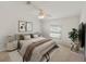 Comfortable bedroom with neutral tones, a plush bed, and stylish decor, creating a serene and inviting space at 37639 Newport Dr, Zephyrhills, FL 33542