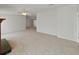 Expansive living room featuring fireplace, neutral walls, and plush carpeting at 37639 Newport Dr, Zephyrhills, FL 33542