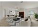 Inviting living room with fireplace, neutral walls, and patterned rug at 37639 Newport Dr, Zephyrhills, FL 33542