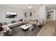 Comfortable living room with stylish decor, a ceiling fan, and an inviting atmosphere for relaxation at 37639 Newport Dr, Zephyrhills, FL 33542