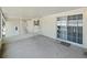 Spacious screened-in porch with sliding glass doors and ample space for outdoor entertaining or relaxing at 37639 Newport Dr, Zephyrhills, FL 33542