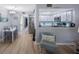 Inviting dining area adjacent to the kitchen, with wood flooring and a view into the kitchen at 404 Hammock Pine Blvd # 404, Clearwater, FL 33761