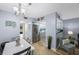 Dining area with open layout to the kitchen, refrigerator, and view of the living space at 404 Hammock Pine Blvd # 404, Clearwater, FL 33761