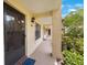 Inviting entryway with well-maintained landscaping and a secure front door at 404 Hammock Pine Blvd # 404, Clearwater, FL 33761