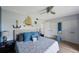 Bright bedroom with coastal decor, featuring a ceiling fan, and plenty of storage at 404 Hammock Pine Blvd # 404, Clearwater, FL 33761