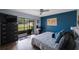 Bedroom featuring a sliding glass door to the outside and a dedicated office space at 404 Hammock Pine Blvd # 404, Clearwater, FL 33761