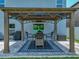 Covered outdoor seating area in backyard, great for entertaining and outdoor living at 413 Royal Empress Dr, Ruskin, FL 33570