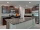 Open kitchen showcasing granite countertops, stainless steel appliances, and ample cabinet space at 413 Royal Empress Dr, Ruskin, FL 33570