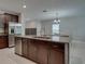 Kitchen island with stainless steel dishwasher and view of the dining area at 413 Royal Empress Dr, Ruskin, FL 33570