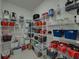 Walk-in pantry featuring wire shelving filled with groceries and storage containers at 413 Royal Empress Dr, Ruskin, FL 33570