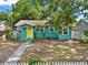 Charming bungalow with bright yellow front door, well-maintained lawn, and inviting curb appeal at 4330 7Th N Ave, St Petersburg, FL 33713
