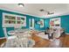 Open-concept staged living and dining room with wood floors, modern furniture, and lots of light at 4330 7Th N Ave, St Petersburg, FL 33713