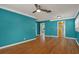 Open concept living room with wood floors, neutral walls, and views into the kitchen area at 4330 7Th N Ave, St Petersburg, FL 33713