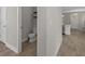 View into a half bath with modern fixtures, toilet, and wood look flooring at 444 49Th N St, St Petersburg, FL 33710