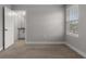 Spacious bedroom with plush carpeting, a large window with blinds, and neutral paint at 444 49Th N St, St Petersburg, FL 33710