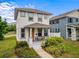 Inviting two-story home with a cozy front porch perfect for relaxing and enjoying the neighborhood at 444 49Th N St, St Petersburg, FL 33710
