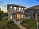 Charming two-story home with a welcoming front porch and meticulously maintained landscaping at 444 49Th N St, St Petersburg, FL 33710