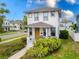 Charming two-story home with landscaped front yard and covered front porch in a suburban neighborhood at 444 49Th N St, St Petersburg, FL 33710