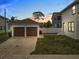 Detached two-car garage and well-maintained backyard adjacent to the main house at 444 49Th N St, St Petersburg, FL 33710