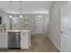 Open-concept kitchen with stainless steel appliances and hardwood floors near the entrance at 444 49Th N St, St Petersburg, FL 33710