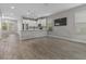 Bright, open-concept living space with hardwood floors, kitchen, and dining area at 444 49Th N St, St Petersburg, FL 33710