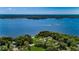 Aerial view showing the property's proximity to the water, green spaces, and recreational amenities at 4452 Bardsdale Dr, Palm Harbor, FL 34685