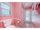 Bathroom featuring flamingo themed shower and a view of the pool through the sliding door at 4452 Bardsdale Dr, Palm Harbor, FL 34685