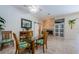 Dining area view features fireplace, sliders, and serving area at 4452 Bardsdale Dr, Palm Harbor, FL 34685