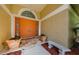 Inviting front double door entry with potted plants at 4452 Bardsdale Dr, Palm Harbor, FL 34685