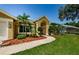 Home's walkway and landscaping leading to the front entrance at 4452 Bardsdale Dr, Palm Harbor, FL 34685
