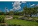Scenic grounds with walking paths, landscaping, and views of the water promote an active lifestyle at 4452 Bardsdale Dr, Palm Harbor, FL 34685