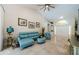 Bright living room features vaulted ceilings, tile flooring, and comfortable seating with an abundance of natural light at 4452 Bardsdale Dr, Palm Harbor, FL 34685