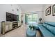 Living room with a view of the lanai and pool at 4452 Bardsdale Dr, Palm Harbor, FL 34685